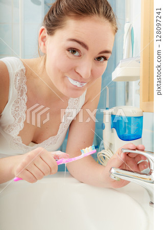 Woman brushing cleaning teeth. Oral hygiene. Woman brushing cleaning teeth. Oral hygiene. 128097241