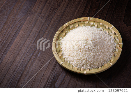 Rice in a colander Rice in a colander 128097621