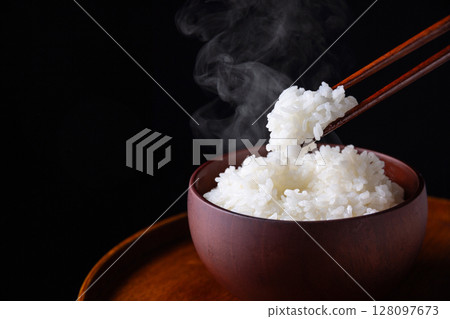 White rice on a black background 128097673