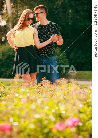 Happy couple around flowers 128097846