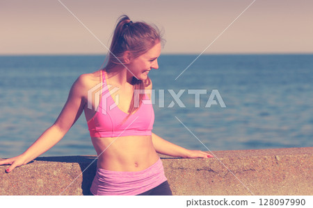 Woman resting relaxing after doing sports outdoors Woman resting relaxing after doing sports outdoors 128097990