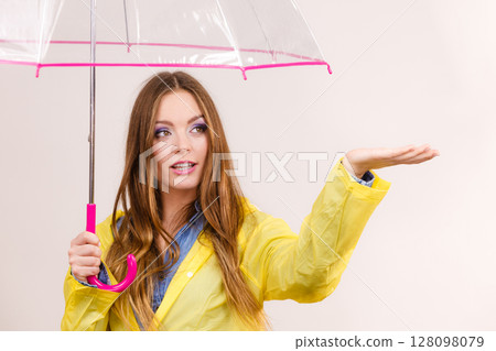 Woman in rainproof coat with umbrella. Forecasting Woman in rainproof coat with umbrella. Forecasting 128098079