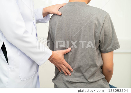 Physical therapy, Asian therapist doctor treat perform pain young man in hospital. Physical therapy, Asian therapist doctor treat perform pain young man in hospital. 128098294
