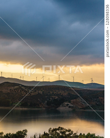 Andalucia at sunset with wind turbines, Spain 128098336