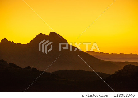 Sunrise over mountain hills 128098340