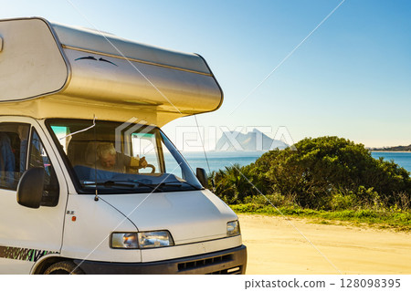 Caravan on spanish coast, Gibraltar rock on horizon 128098395