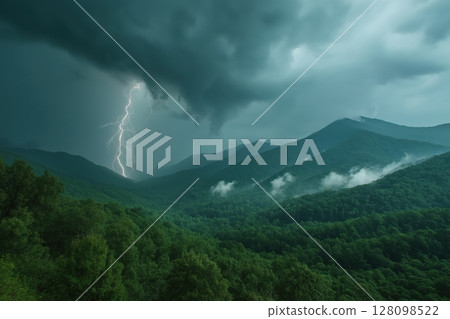 Storm clouds swirl over misty forested mountains in dramatic time-lapse view 128098522