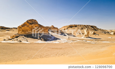 White rock formations and sand dunes in Egypt's White Desert, natural desert landscape White rock formations and sand dunes in Egypt's White Desert, natural desert landscape 128098700