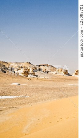 White rock formations and sand dunes in Egypt's White Desert, natural desert landscape	 128098701