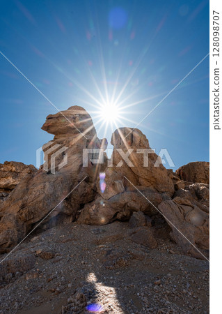 White rock formations and sand dunes in Egypt's White Desert, natural desert landscape White rock formations and sand dunes in Egypt's White Desert, natural desert landscape 128098707