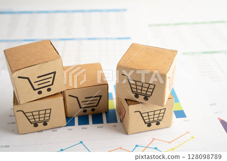 Online shopping, Shopping cart box on business graph, import export, finance commerce. Online shopping, Shopping cart box on business graph, import export, finance commerce. 128098789