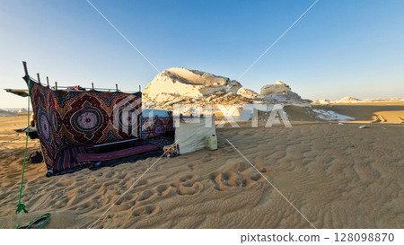 White rock formations and sand dunes in Egypt's White Desert, natural desert landscape White rock formations and sand dunes in Egypt's White Desert, natural desert landscape 128098870