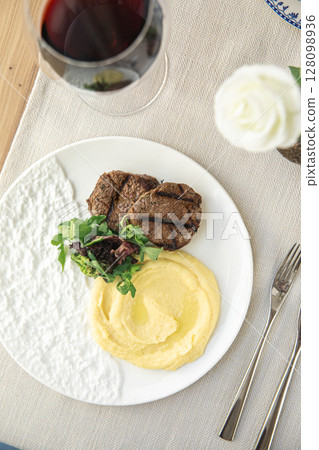 Beef medallions with mashed potatoes and greens Beef medallions with mashed potatoes and greens 128098936