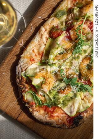 Pinsa with shrimp, zucchini and pesto 128098940