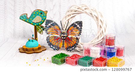 Colorful glass beads. Variety of shapes and colors to make a bead necklace or a string of beads for women Colorful glass beads. Variety of shapes and colors to make a bead necklace or a string of beads for women 128099767