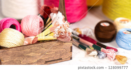 Threads in reels. Colored bobbins for embroidery knitting hobby accessories creativity. Threads in reels. Colored bobbins for embroidery knitting hobby accessories creativity. 128099777