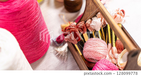Threads in reels. Colored bobbins for embroidery knitting hobby accessories creativity. Threads in reels. Colored bobbins for embroidery knitting hobby accessories creativity. 128099778