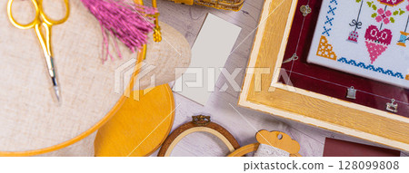 Accessories for hobby. Hoop snaps, scissors, threads, needles and scissors. Vintage tools for embroidery and knitting 128099808