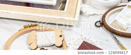 Accessories for hobby. Hoop snaps, scissors, threads, needles and scissors. Vintage tools for embroidery and knitting 128099817