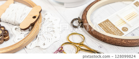 Accessories for hobby. Hoop snaps, scissors, threads, needles and scissors. Vintage tools for embroidery and knitting Accessories for hobby. Hoop snaps, scissors, threads, needles and scissors. Vintage tools for embroidery and knitting 128099824