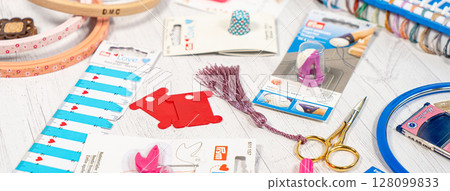 Accessories for hobbies. Needles, threads, hoops snaps, marker, stick for knitting and embroidery Accessories for hobbies. Needles, threads, hoops snaps, marker, stick for knitting and embroidery 128099833