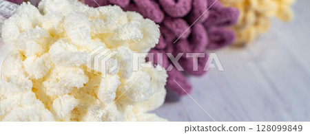Fluffy yarn. Colored threads in reels. Knitting hobby embroidery 128099849