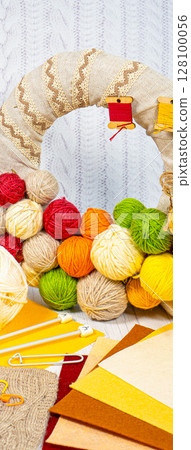 Threads in reels. Colored bobbins for embroidery knitting hobby accessories creativity. Threads in reels. Colored bobbins for embroidery knitting hobby accessories creativity. 128100056
