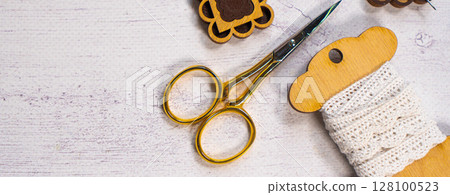 Accessories for hobby. Hoop snaps, threads, needles and scissors. Vintage tools for embroidery and knitting 128100523