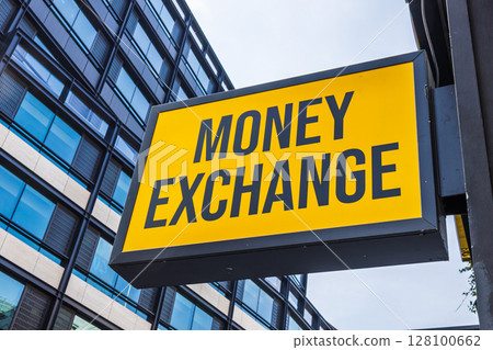 Hanging Money Exchange board in city financial district offers travel cash and forex service Hanging Money Exchange board in city financial district offers travel cash and forex service 128100662