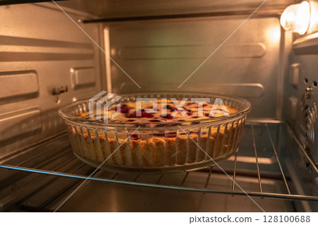 Berry Pie Baking: Daytime oven bakes homemade dessert for enjoyment in kitchen. 128100688