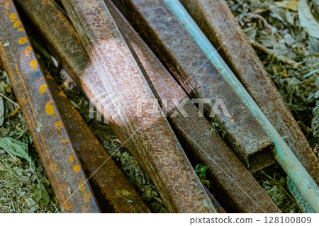 Steel rods bars, Metal, and Iron reinforcement lying on the ground on the construction site for material used for reinforcing concrete building construction. Concept background textured architecture 128100809