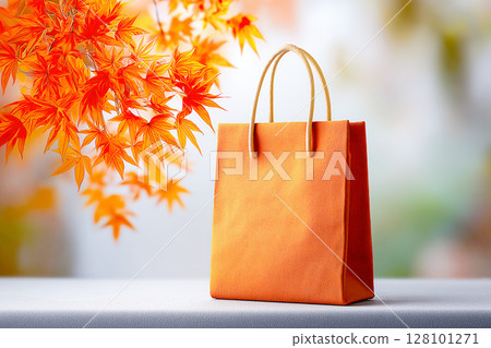 Autumn shopping bag on table and blurred background 128101271