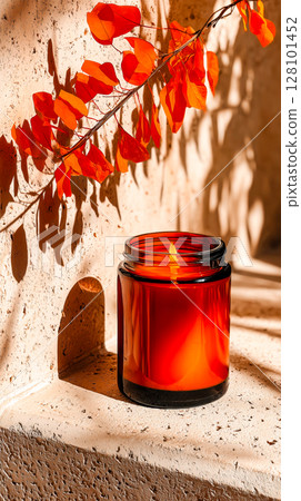 Red candle with burning flame and autumn leaves Red candle with burning flame and autumn leaves 128101452