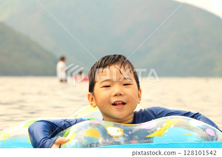Children enjoying playing in water 128101542