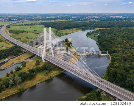 Cable stayed bridge over Odra river with cars driving on highway in Wroclaw, Poland Cable stayed bridge over Odra river with cars driving on highway in Wroclaw, Poland 128102429