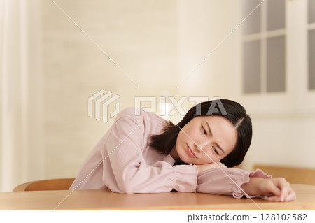 Woman feeling down at night 128102582
