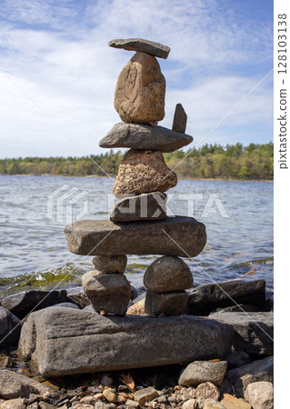 Balanced Stones Sculpture by the Tranquil Lakeside Shore, Canada. Balanced Stones Sculpture by the Tranquil Lakeside Shore, Canada. 128103138