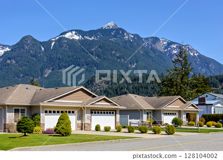 Street of residential duplex house on beautiful nature background in British Columbia 128104002
