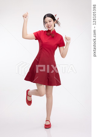 Full body portrait of joyful beauty Asian woman in red Cheongsam Chinese traditional dress celebrating and dancing isolated on white background. Full body portrait of joyful beauty Asian woman in red Cheongsam Chinese traditional dress celebrating and dancing isolated on white background. 128105398
