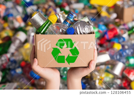 hand holding box of garbage for recycling. Reuse reduce recycle concept. hand holding box of garbage for recycling. Reuse reduce recycle concept. 128106455