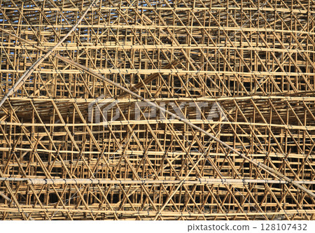 bamboo scaffolding pole cover the tower building wall cover the wan chai convention centre (HKCEE) , asian architectural background in hong kong china 128107432