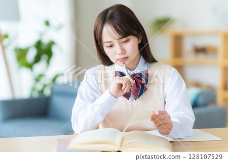 High school girl who is worried while studying at home 128107529