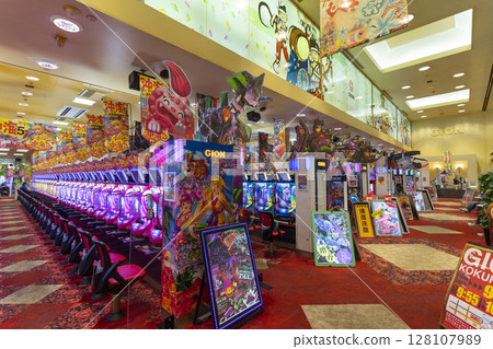 Okinawa, Japan - June 10,2019 : Unidentified people plays an arcade machines in Jumbo Pachinko Arcade in Naha, Okinawa, Japan on June 10,2019. 128107989