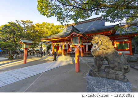 Fukuoka, Japan - Dec 27, 2022 : Beautiful view of the Sumiyoshi shrine with blue sky in Fukuoka, Japan on Dec 27, 2022. Fukuoka, Japan - Dec 27, 2022 : Beautiful view of the Sumiyoshi shrine with blue sky in Fukuoka, Japan on Dec 27, 2022. 128108082