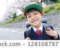 Elementary school entrance. A shiny first grader carrying a school bag. Asian Japanese boy. 128108787