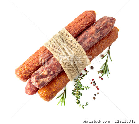 Dry cured sausages with spices isolated on a white background. Dry cured sausages with spices isolated on a white background. 128110312