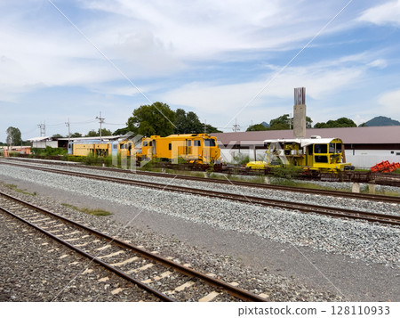 Yellow Maintenance Train at Railway Construction Office. 128110933