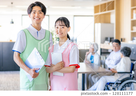 Caregivers for young men and women working in nursing homes 128111177