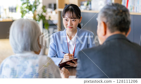 Senior couple consulting the window 128111206