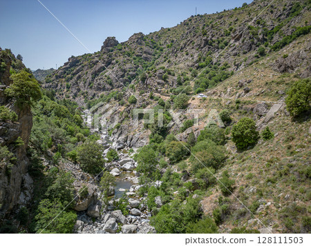 Camping Caravan driving through Canyon de la Ruda road Corsica down the pass monte Cino 128111503